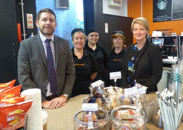 Eamonn Murphy, Sodexo account manager, and, right, Alison Maynard, deputy chief executive of Tyne Coast College, with catering staff.