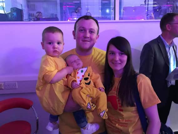 Mark and Alice Beadle from South Shields with their children Ethan (left) who has cerebral palsy and baby Harrison at the Pudsey Party in Carlisle.