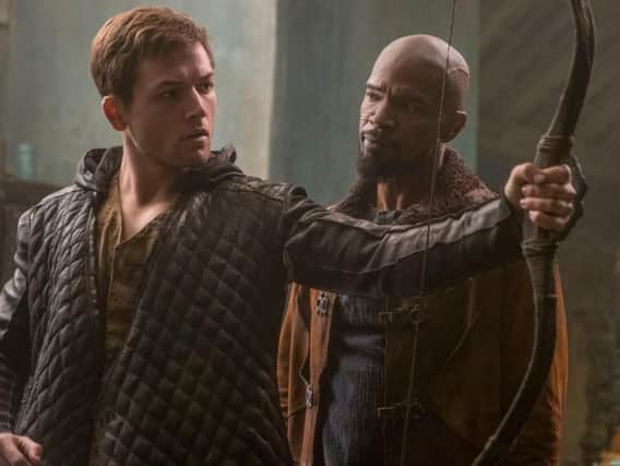 Taron Egerton and Jamie Foxx in Robin Hood.