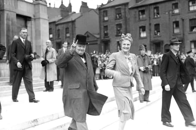 Winston Churchill leaving the Civic Hall with Mrs. Churchill in 1945.