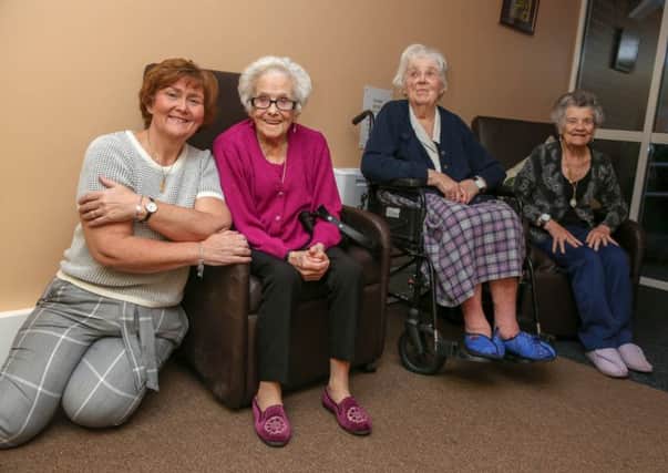 Tracey Dixon with residents of Clasper Court. Clasper Court has had work carried out on the building to make it more accommodating to those who need more support to live independently. Picture by Tom Banks