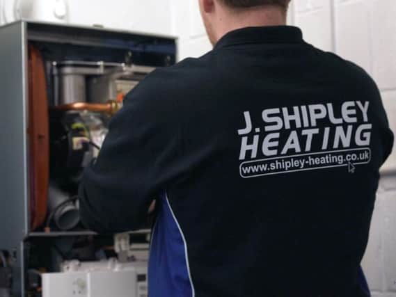 J Shipley heating engineer fixing boiler
