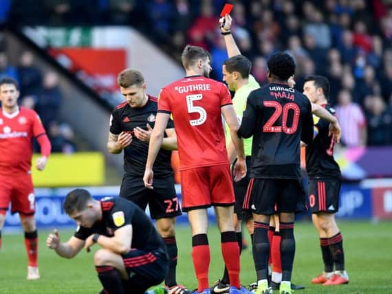 Max Power is shown a straight red against Walsall, his third of the season.