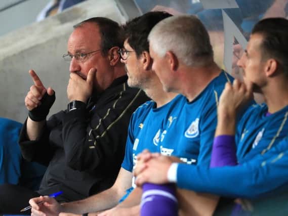 Newcastle United manager Rafa Benitez and his coaching staff