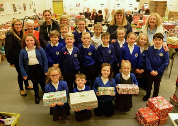 Pupils and staff from Westoe Crown Primary School with their shoeboxes.