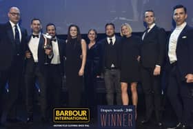 Barbour International staff accept their award.