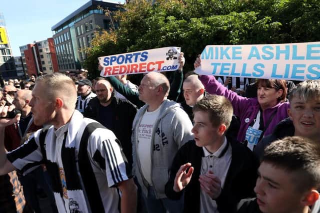 Newcastle United fans protesting against Mike Ashley.