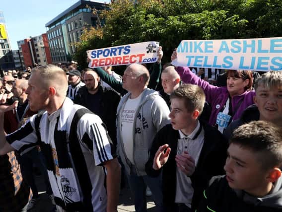 Newcastle United fans protesting against Mike Ashley.