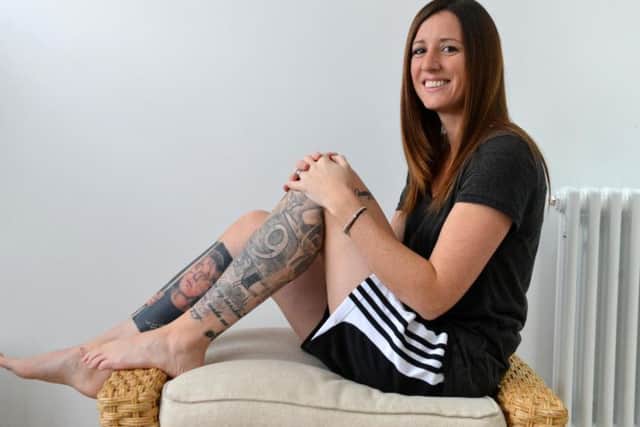 Coronation Street enthusiast Rebecca Haynes with her tattooed legs.