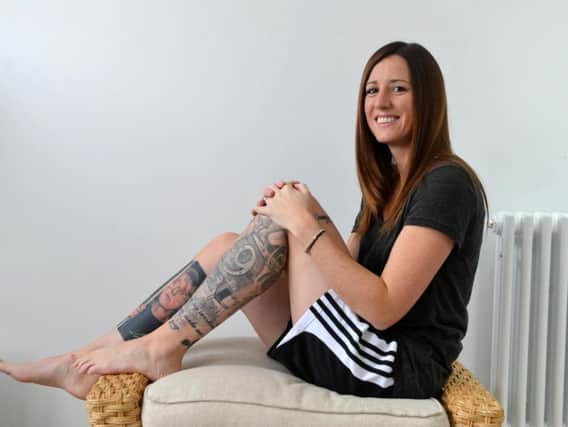 Coronation Street enthusiast Rebecca Haynes with her tattooed legs.