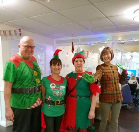 Dressed as elves to raise funds for the Alzheimers Society are (from left)
Willowdene Care Home manager Michael Beaney, activities coordinators Christine Chandler and Amanda Rowden and a residents family member Joyce Welsh.