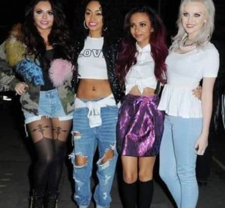 Jade Thirlwall and her Little Mix bandmates wearing the skirt she donated to the charity.