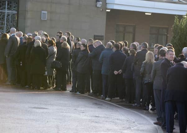 Mourners at the funeral of Geoff Ford of Ford Aerospace Ltd.