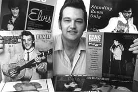 Trevor Cajiao with some of his Elvis records.
