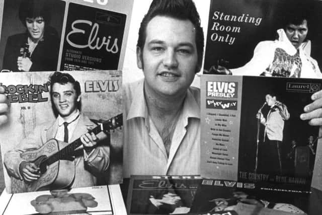 Trevor Cajiao with some of his Elvis records.