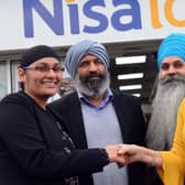 Cancer Connections Deborah Roberts receives donations from Nisa Whiteleas owners Mick Singh and Happy Kaur, who are with friend and charity supporter Tony Singh.