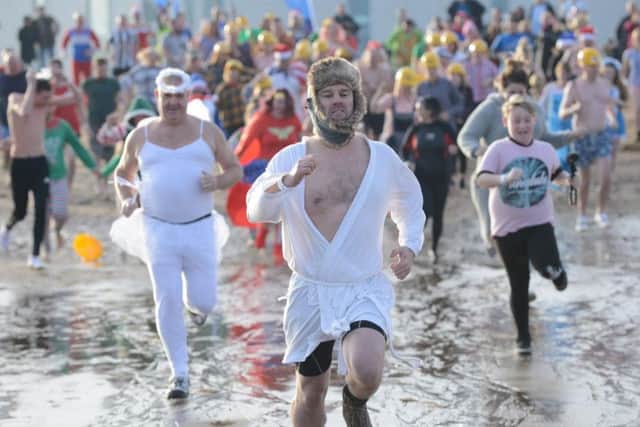 Fundraisers taking part in the Boxing Day Dip for St Clare's Hospice.