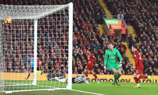 Liverpool's Xherdan Shaqiri scores his side's third goal.