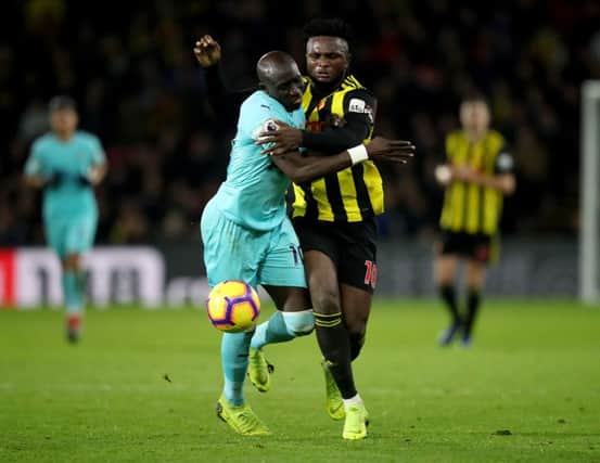 Mohamed Diame (left) battles for the ball with Watford's Isaac Success.