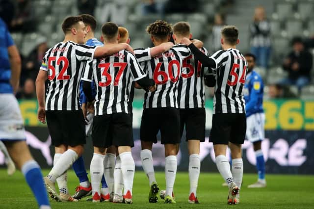 Newcastle's players celebrate against Macclesfield in the last round.