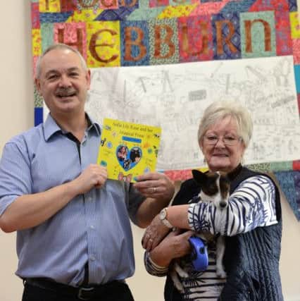 Former St Aloysious RC Primary School pupil author John Grieves book launch. Mother Julia Devine also a former pupil of the school, with koby the dog