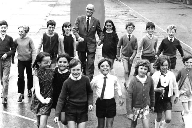 Back in   July 1971, pupils of Cleadon Park Junior School with their headmaster Mr Pnilip Ward, who has retired after 15 years at the school.