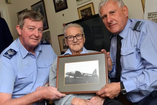 Former RAF World War two veteran Harold Yeoman has a visist from serving RAF officers. Officers from left Flt.Sgt John Collins and Flt.Lt Nigel Yarrow