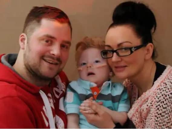 Chris and Sarah Cookson with their first son Charlie.