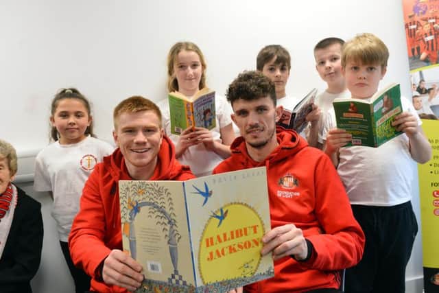 SAFC players Duncan Watmore and Tom Flanagan vists the Beacon of Light as part of National Storytelling Week with Jarrow Cross C of E Primary School pupils.
