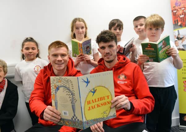 SAFC players Duncan Watmore and Tom Flanagan vists the Beacon of Light as part of National Storytelling Week with Jarrow Cross C of E Primary School pupils.