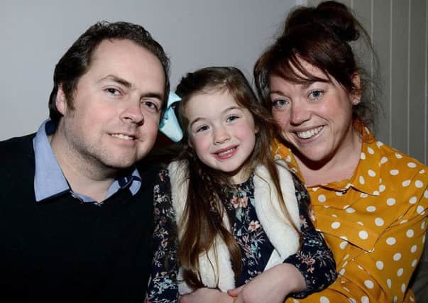 Merryn Chapman with her dad Keith and mum Rachael Thompson-Chapman. Picture by FRANK REID