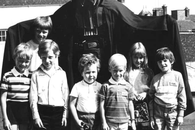 Star Wars' Darth Vader popped into T&G Allan's shop in King Street in Memory Lane social flow  August 1983.  From left:  David Wardle, Lee Foster, Graham Hunter, Ben Alexander, Stewart Cross, Victoria Watson and Paul Kolster.