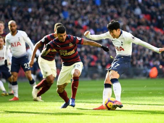 Tottenham's Son Heung-min takes a shot against Newcastle.