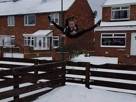 Jump! Olivia Jobes shows off her moves in the snow. Picture: Hayley Wilson.