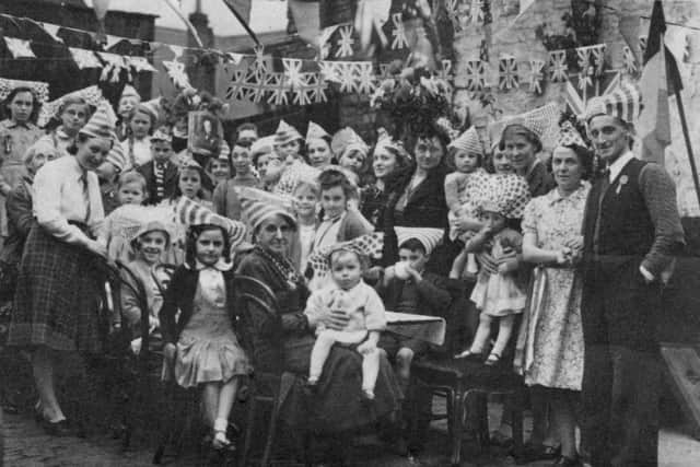 Alan Clark is the small baby at the front of the picture taken during a VE day party.