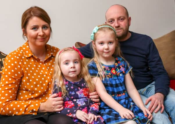 Harriet Corr, 4, who suffers from Cystic Fibrosis with her mother Emma Corr big sister Nancy, 6, and dad Chris.