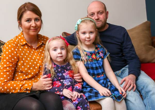 Harriet Corr, 4, who suffers from cystic fibrosis with her mother Emma, sister Nancy, 6, and dad Chris.