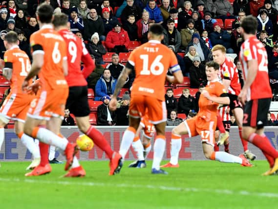 Duncan Watmore gets a shot away in the 1-1 draw with Blackpool.