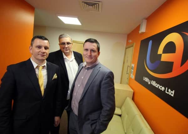 Utility Alliance managing directors Bob Moore (left) and Phill Moore (right) and CEO Darren Sutherland (centre).
