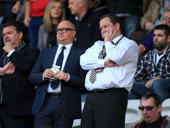 Newcastle United owner Mike Ashley (right) flanked by Lee Charnley.