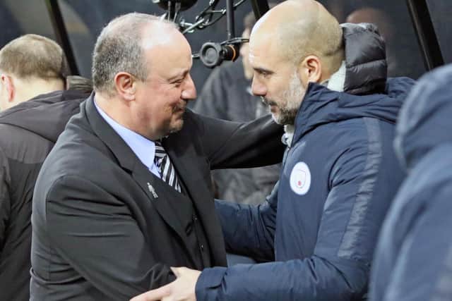 Newcastle United manager Rafa Benitez (right) with Manchester City boss Pep Guardiola.