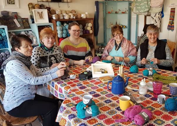Volunteers creating crafts at WHIST
