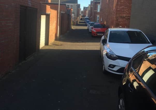 Cars parked in the back lane of Berkeley Street in South Shields.
