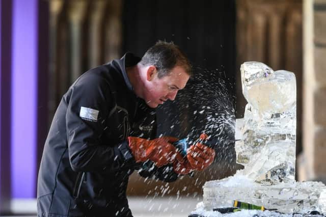 Mat Chaloner of Glacial Art, at work on a ice sculpture at Durham Cathedral