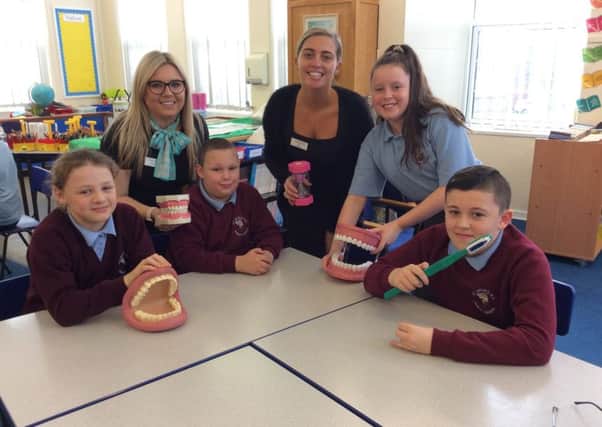 Anthea Smith (l) and Kara Tully (r) with children from St Bedes Primary School