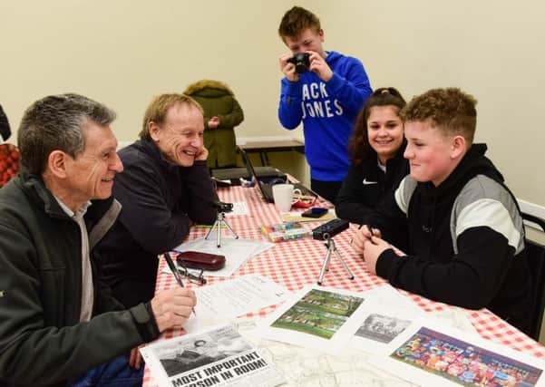 Young people have appealed to the community to help them pull together a history of Bilton Hall, in Jarrow. Former pupils l-r Ken Stephenson and Alan Riseborough are being photographed and interviewed by Alfie Harrison, Gracie Mountain and James Dadswell.