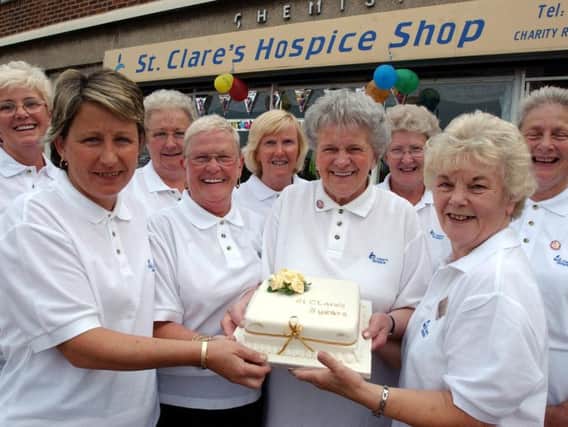 Flashback: Volunteers from St Clare's Hospice shop, in Horsley Hill, hold a cake in 2003 to mark the store's fifth birthday.
