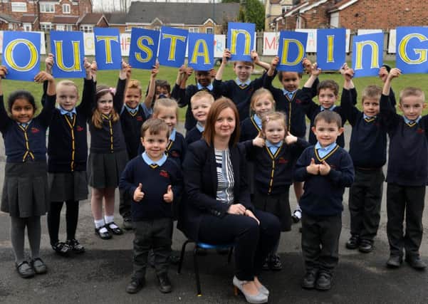 St Aloysius pupils celebrate their  outstanding Ofsted with deputy headteacher Katherine Fenwick