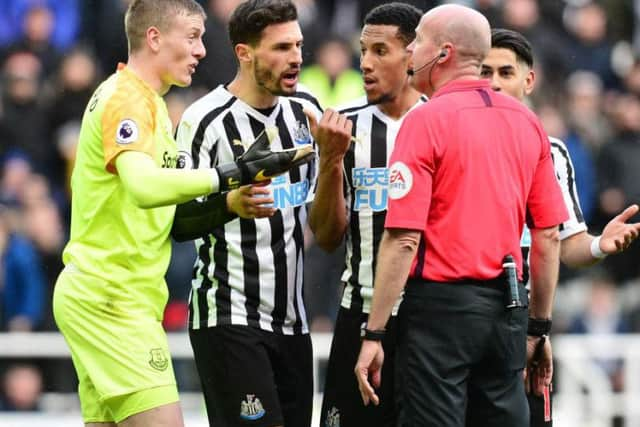 Jordan Pickford, far left, and Lee Mason, right.