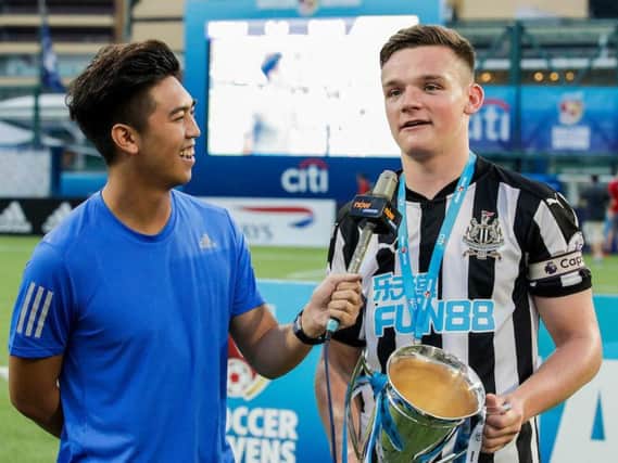 Owen Bailey with the HKFC Citi Soccer Sevens trophy.